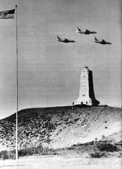 aircraft flying over memorial shaft