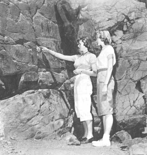 Visitors examining rock art in Picture Gorge