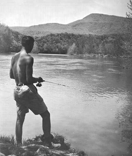 fisherman along bank of Shenandoah River