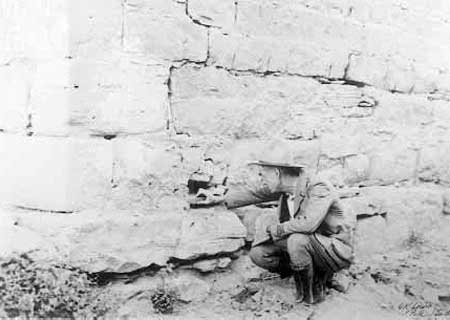 Frank Pinkley inspecting southwest corner of fort