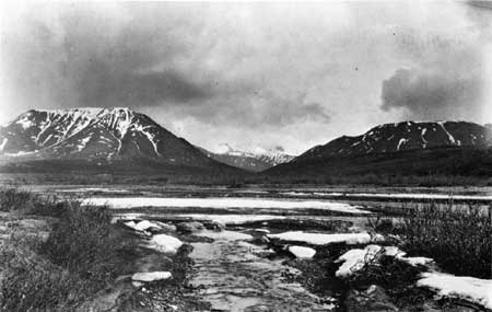 gravel bar below tundra ridges