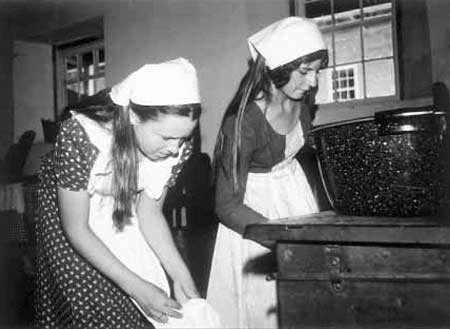 Julie Heaton and Tina Esplin baking cookies