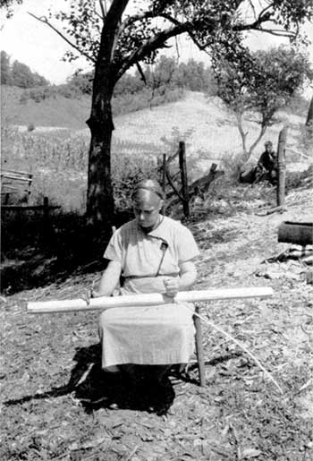 woman marking spirals on rifling guide